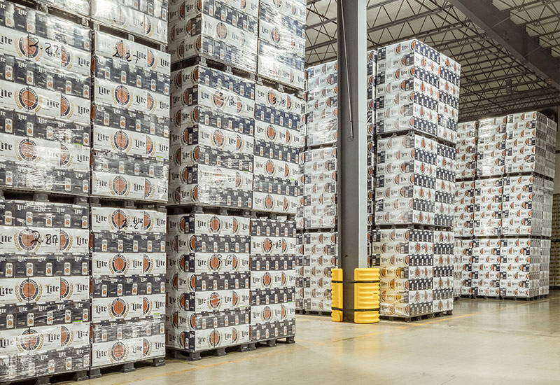 Pallets of Miller Lite cases stacked in warehouse