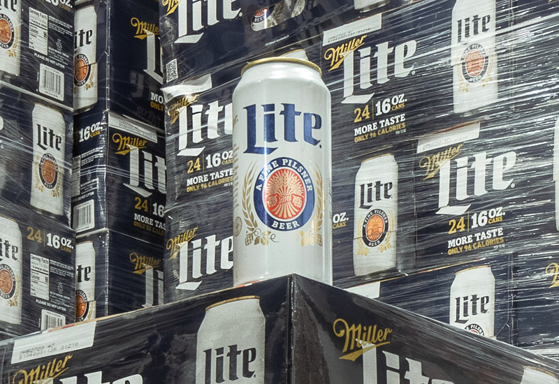 Miller Lite can on top of palettes of boxes